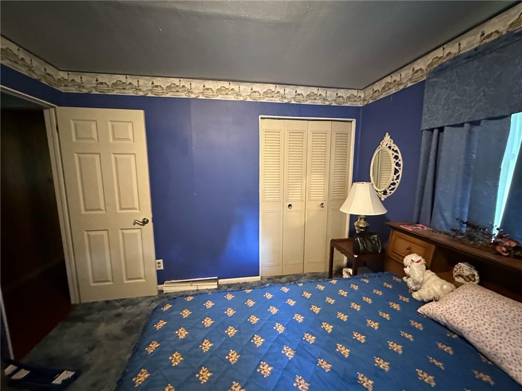 696 Leighty Hollow Road Ruffs Dale, PA 15679 - Photo 27 of 46 a bed room with a bed and a table