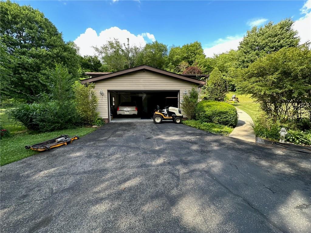 696 Leighty Hollow Road Ruffs Dale, PA 15679 - Photo 3 of 46 a view of a car parked in front of house
