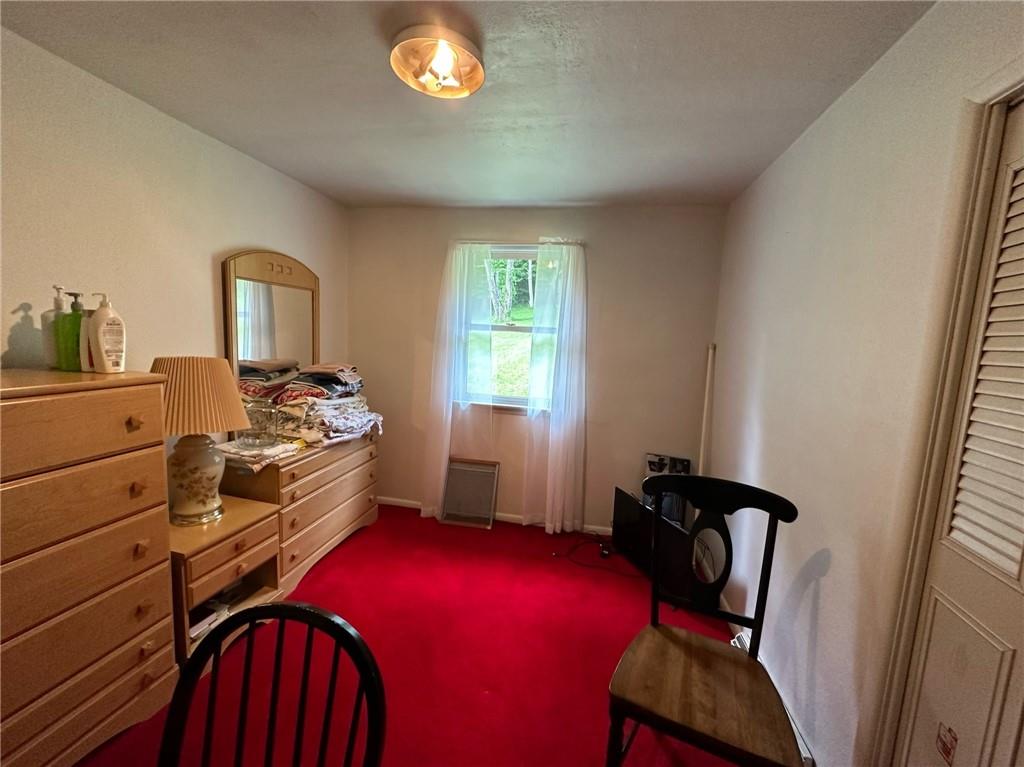 696 Leighty Hollow Road Ruffs Dale, PA 15679 - Photo 31 of 46 a bedroom with a bed and wooden floor