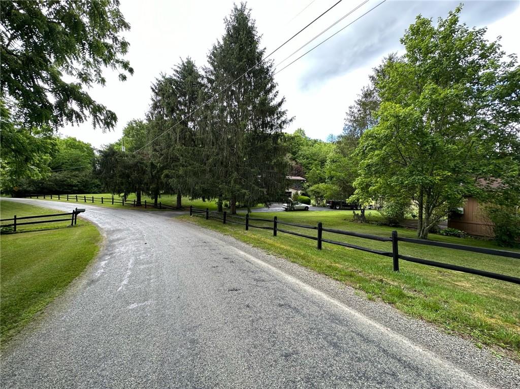 696 Leighty Hollow Road Ruffs Dale, PA 15679 - Photo 45 of 46 a view of park bench with trees