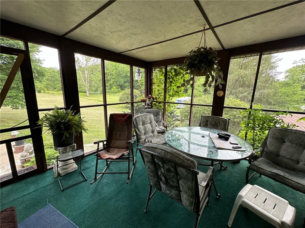 696 Leighty Hollow Road Ruffs Dale, PA 15679 - Photo 10 of 46 a view of a dining room with furniture window and outside view