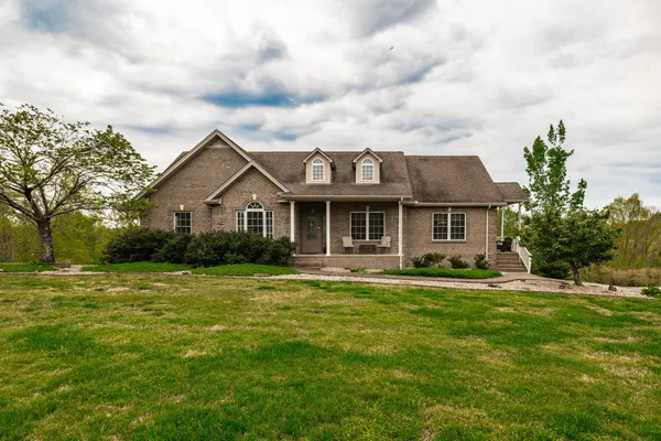 a front view of a house with a yard