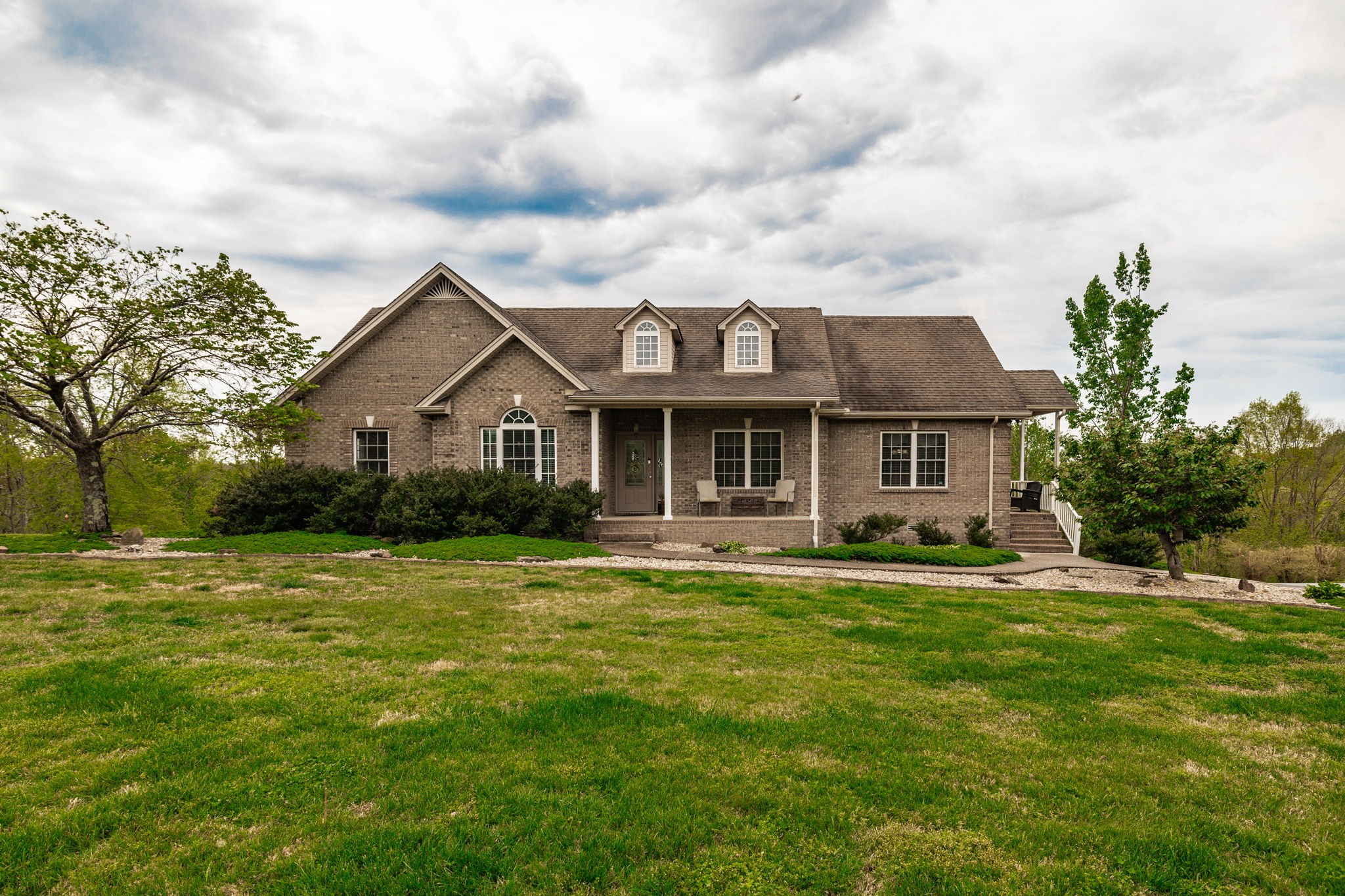 a front view of a house with a yard