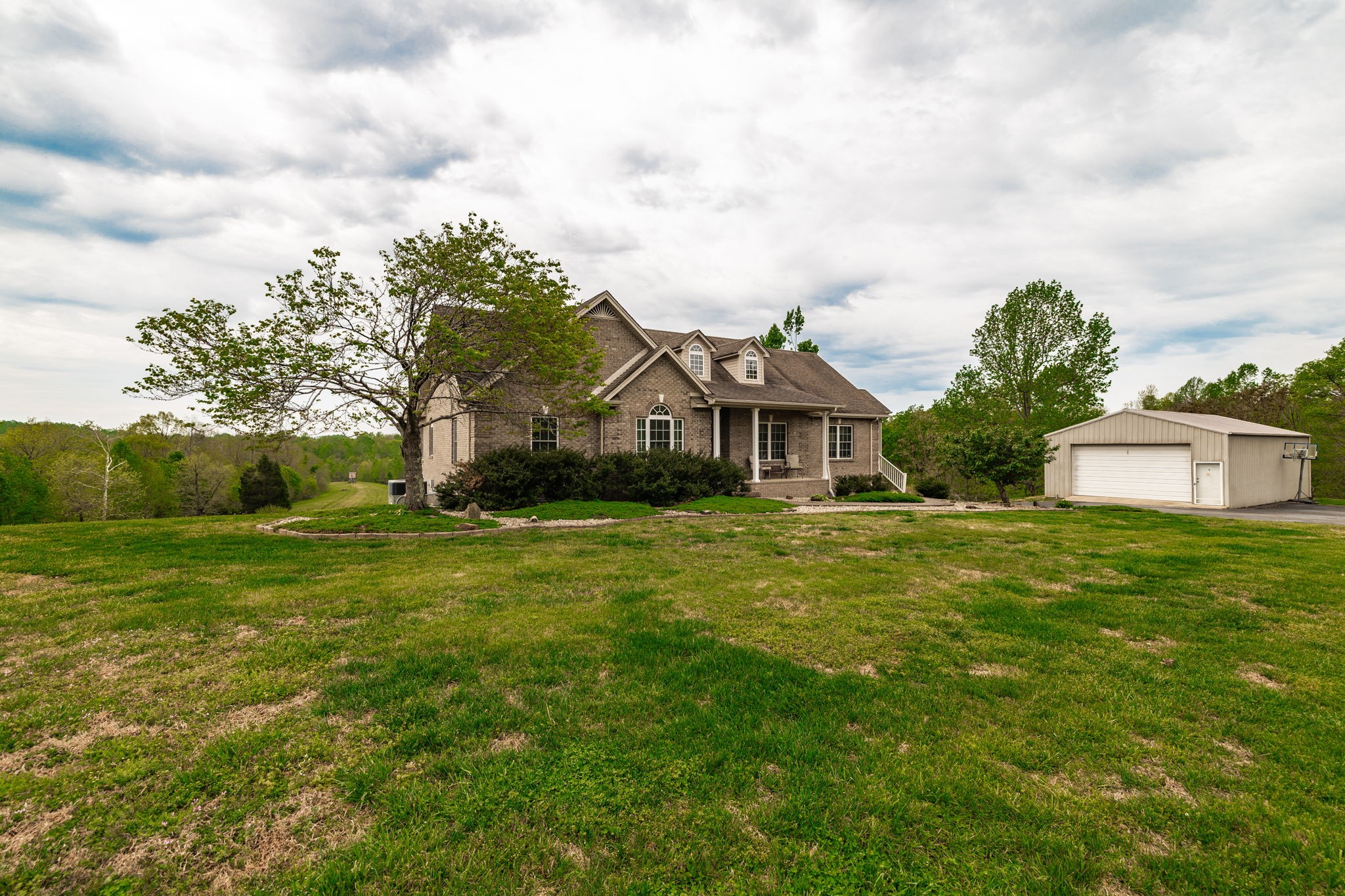 1103 Johnny Spears Road Westmoreland, TN 37186 - Photo 12 of 100 a front view of house with yard and trees in the background