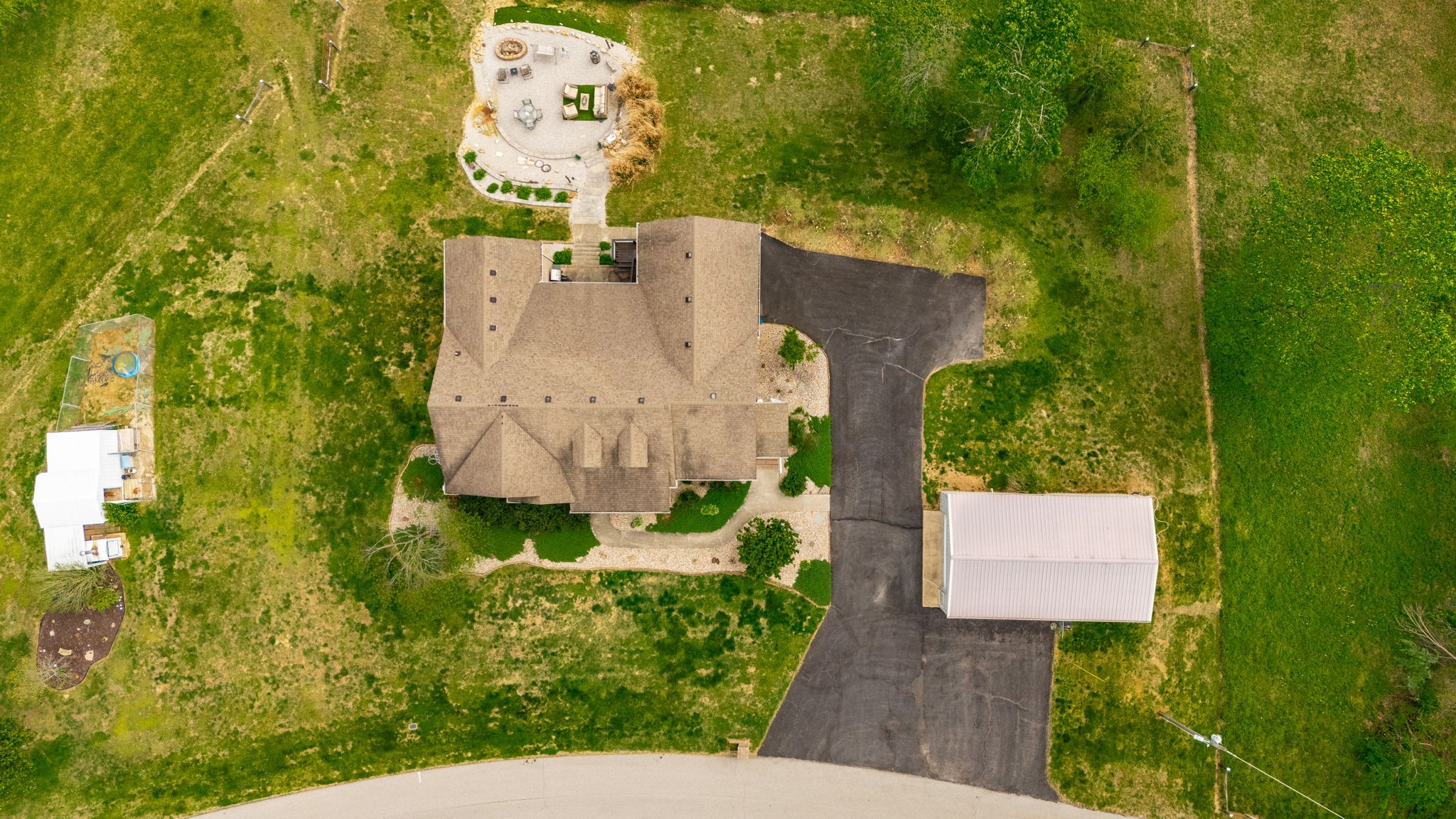 1103 Johnny Spears Road Westmoreland, TN 37186 - Photo 18 of 100 an aerial view of a house with a yard swimming pool and large trees