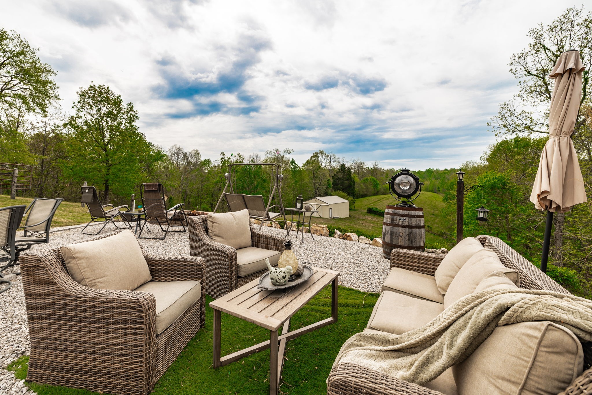 1103 Johnny Spears Road Westmoreland, TN 37186 - Photo 26 of 100 a view of a patio with couches and a table and chairs with garden view