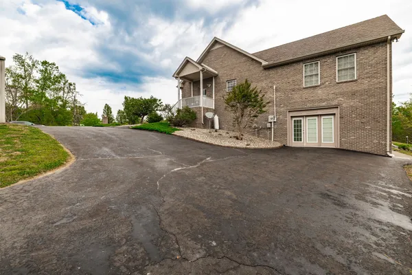 a kitchen with stainless steel appliances granite countertop a refrigerator stove and microwave