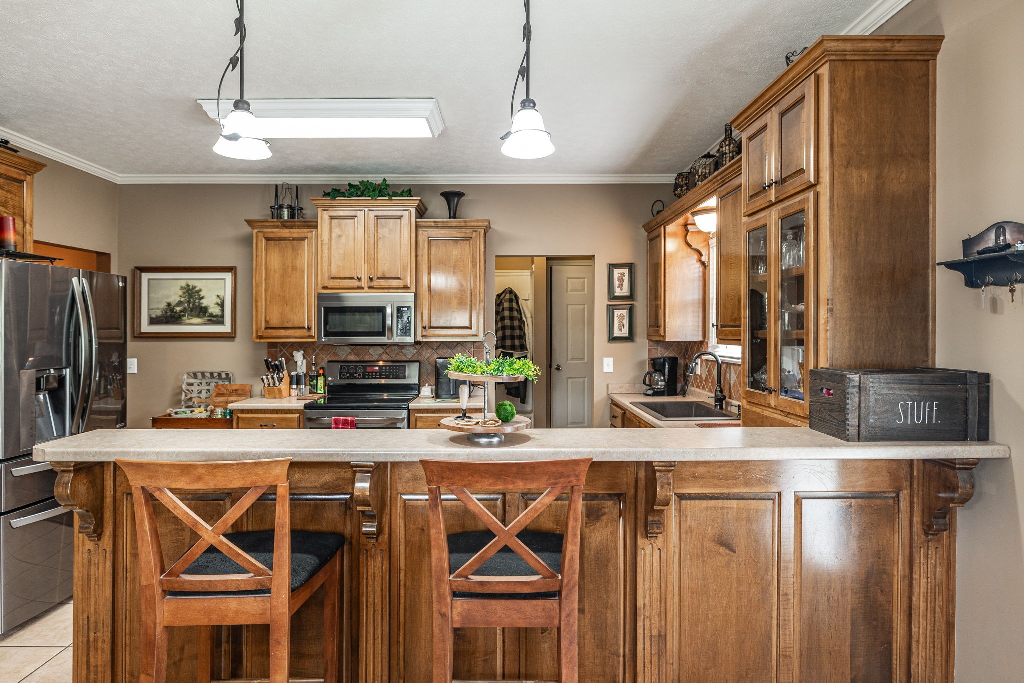 1103 Johnny Spears Road Westmoreland, TN 37186 - Photo 45 of 100 a kitchen with stainless steel appliances granite countertop a sink a stove and a refrigerator