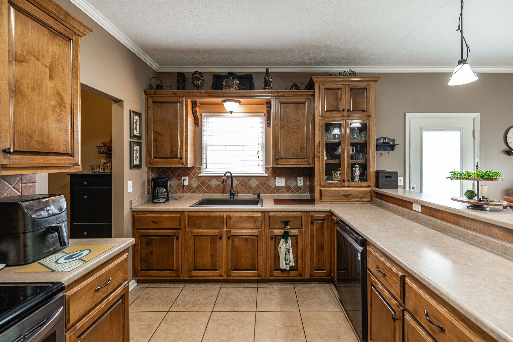 1103 Johnny Spears Road Westmoreland, TN 37186 - Photo 47 of 100 a kitchen with a sink stove and cabinets