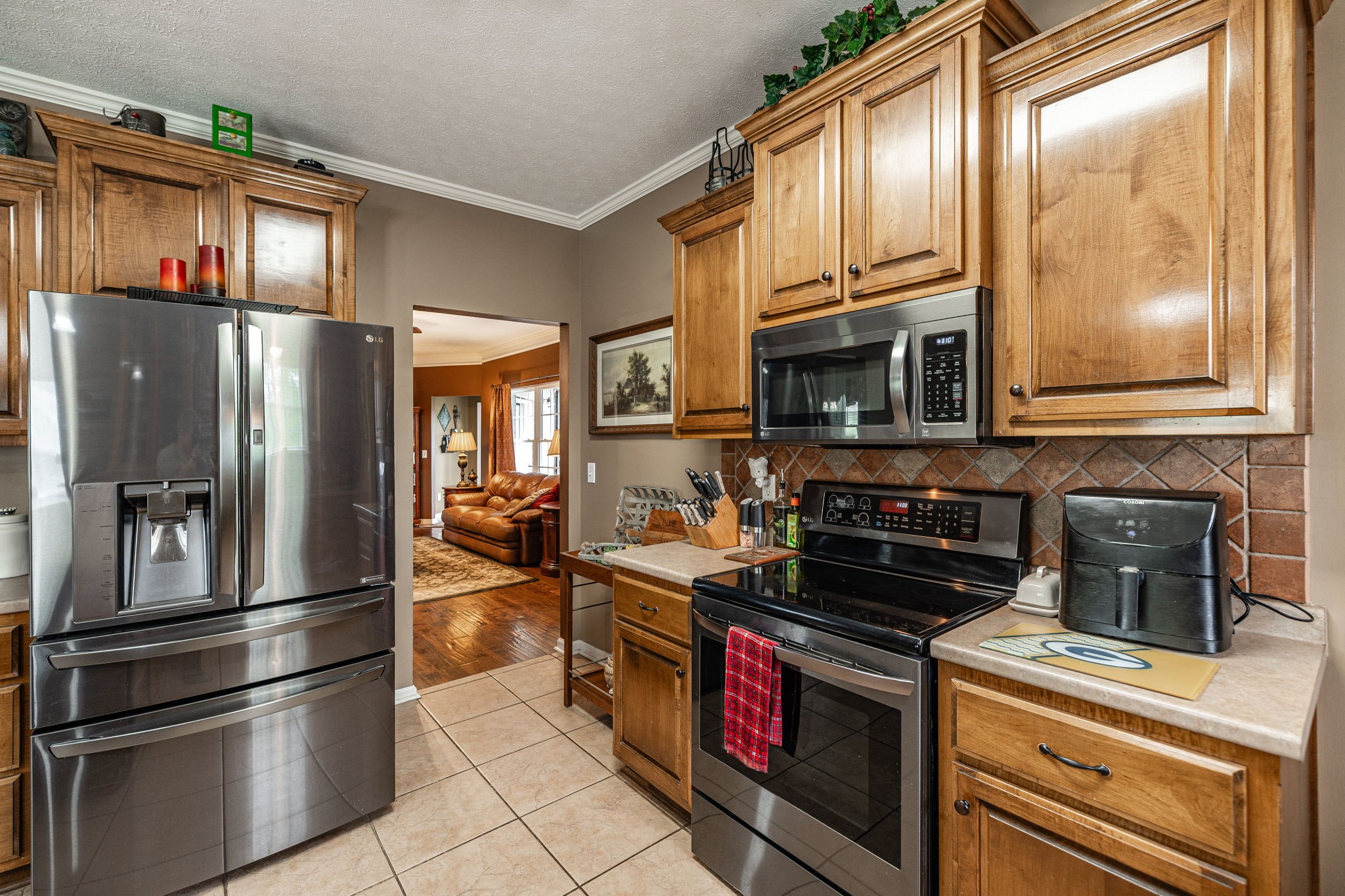 1103 Johnny Spears Road Westmoreland, TN 37186 - Photo 48 of 100 a kitchen with stainless steel appliances granite countertop a refrigerator stove and microwave