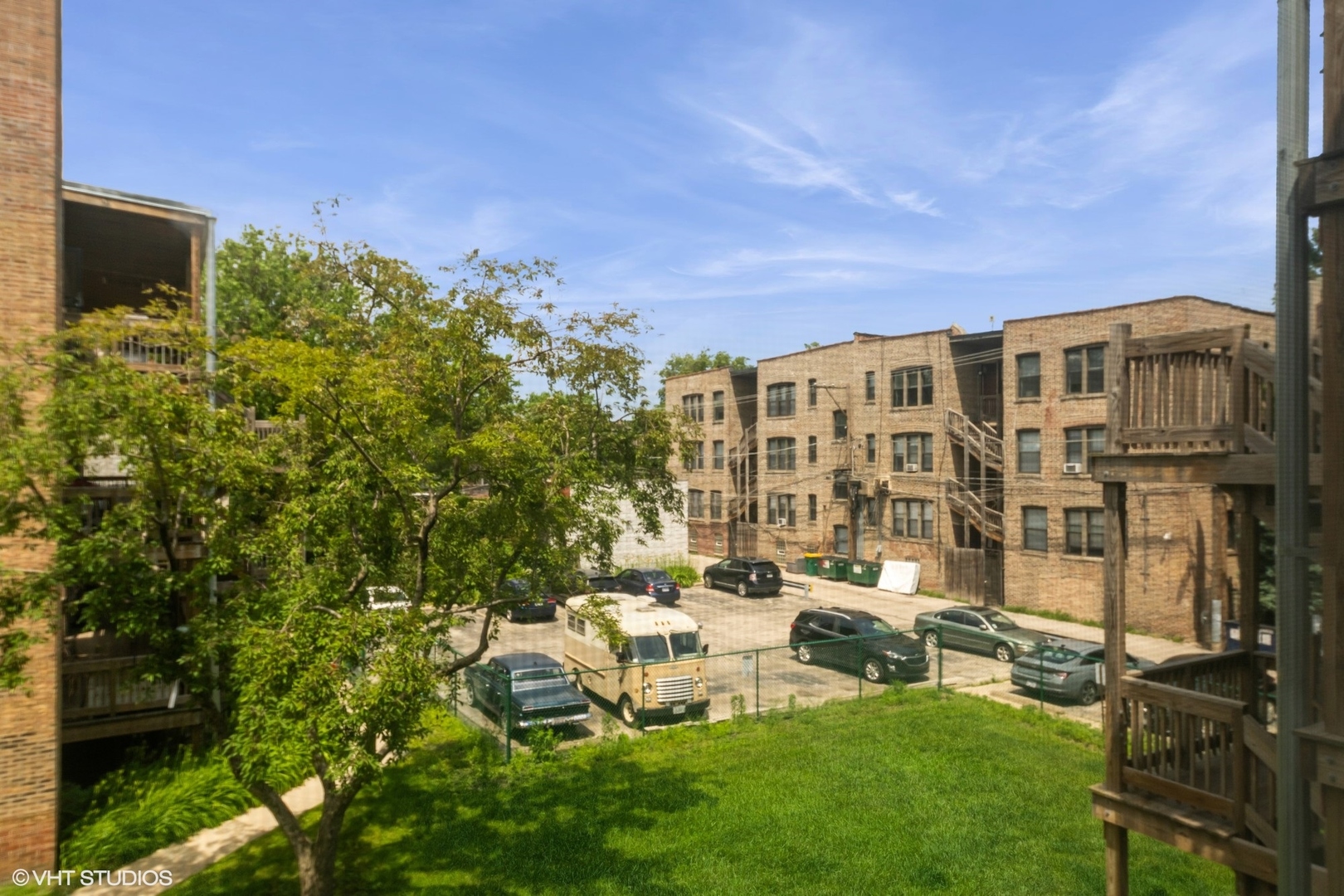 1006 East 54th Street, Unit J2 Chicago, IL 60615 - Photo 15 of 15 a view of a patio with table and chairs and potted plants