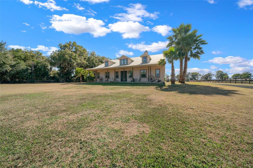 2198 West Highway 329 Citra, FL 32113 - Photo 2 of 57 a view of a house with a yard and lake view