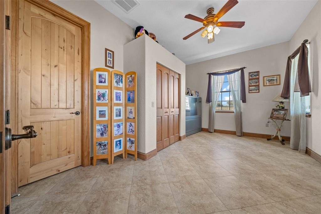 2198 West Highway 329 Citra, FL 32113 - Photo 32 of 57 an empty room with closet and a ceiling fan