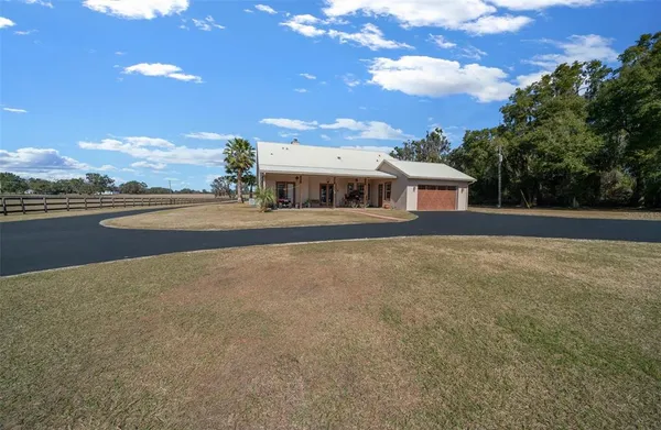 a view of a patio with a yard