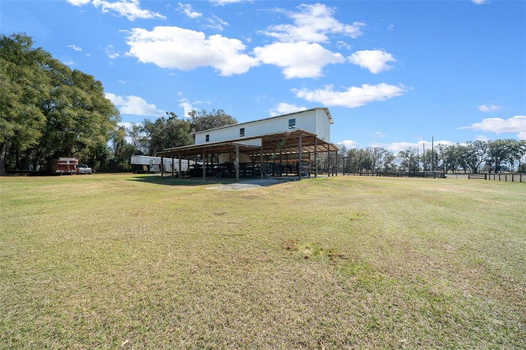 2198 West Highway 329 Citra, FL 32113 - Photo 40 of 57 a view of a lake with houses in the background
