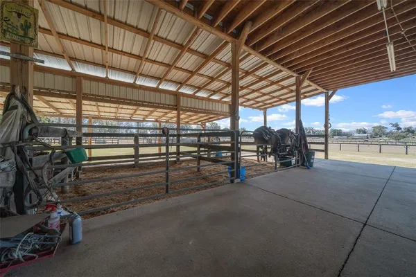a view of a backyard with sitting area