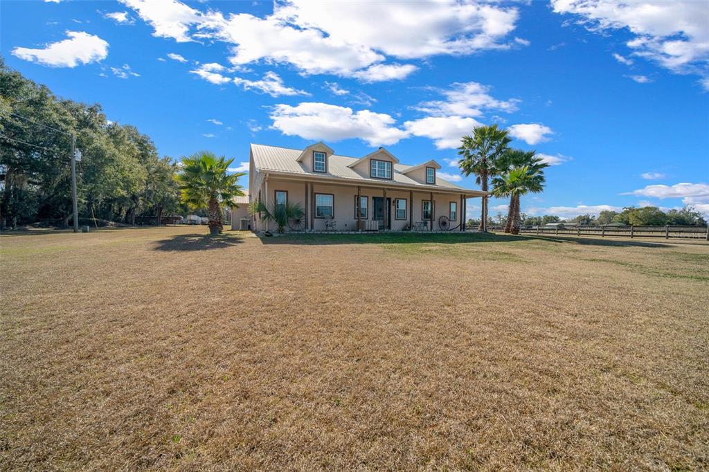 2198 West Highway 329 Citra, FL 32113 - Photo 7 of 57 a view of a house with a yard and lake view