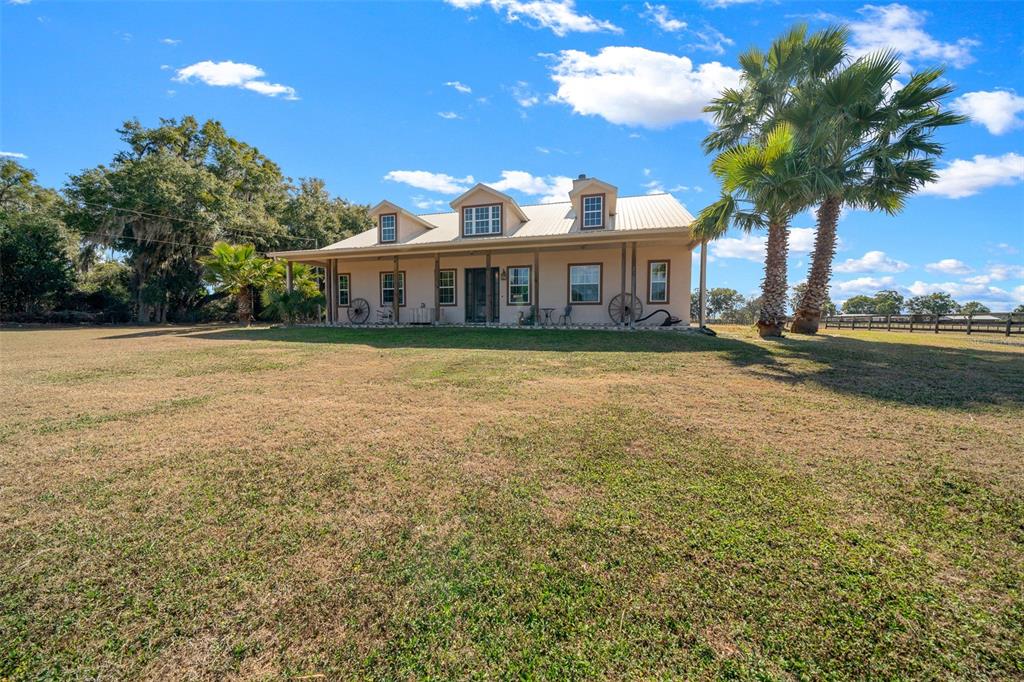 2198 West Highway 329 Citra, FL 32113 - Photo 8 of 57 a view of a house with a yard