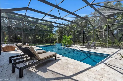 a view of a swimming pool with a patio