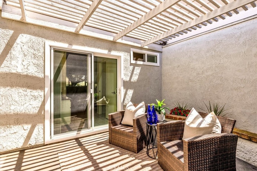 86 Sandpiper, Unit 17 Irvine, CA 92604 - Photo 22 of 56 a outdoor living space with furniture and a potted plant