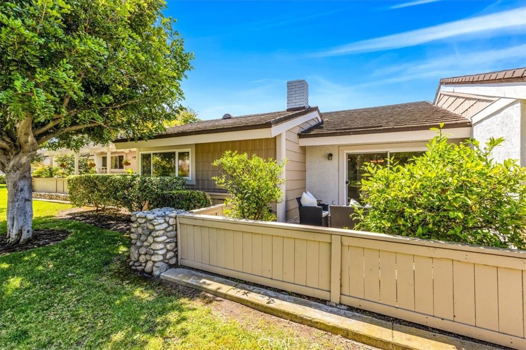 86 Sandpiper, Unit 17 Irvine, CA 92604 - Photo 32 of 56 front view of a house with a yard