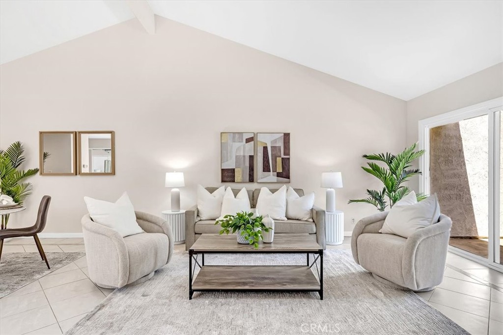 86 Sandpiper, Unit 17 Irvine, CA 92604 - Photo 5 of 56 a living room with furniture and a potted plant