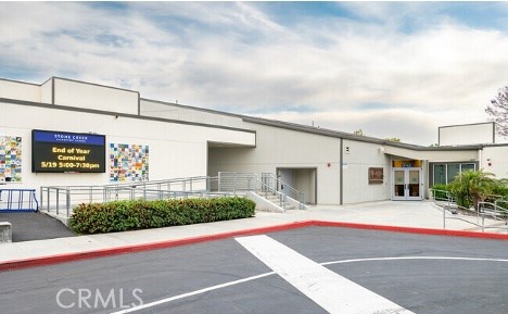 86 Sandpiper, Unit 17 Irvine, CA 92604 - Photo 51 of 56 a front view of a building with traffic signal lights