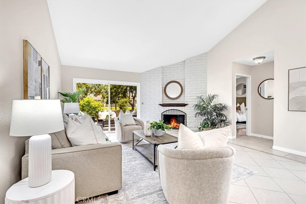 86 Sandpiper, Unit 17 Irvine, CA 92604 - Photo 6 of 56 a living room with furniture and a fireplace