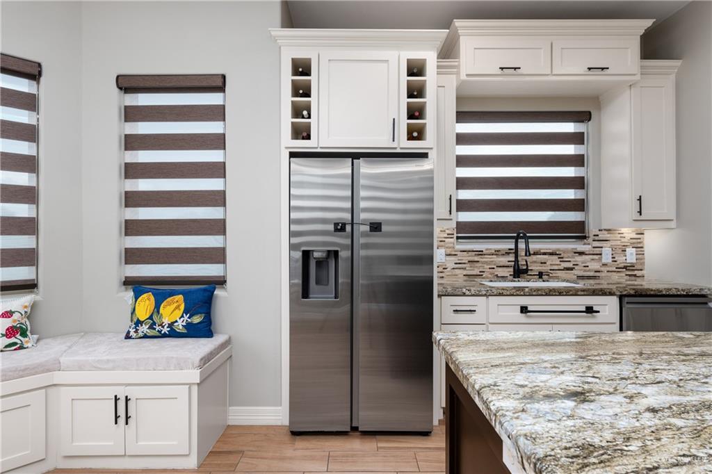 8405 Summer View Court Harlingen, TX 78552 - Photo 11 of 45 a kitchen with stainless steel appliances granite countertop a sink and dishwasher refrigerator oven