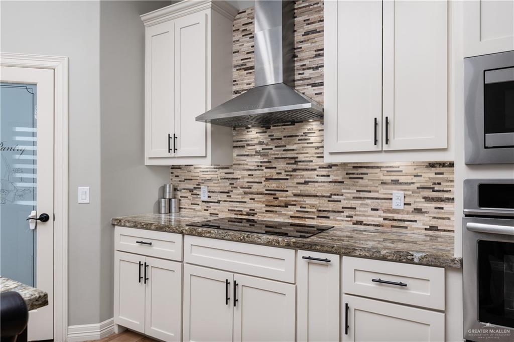 8405 Summer View Court Harlingen, TX 78552 - Photo 13 of 45 a kitchen with stainless steel appliances white cabinets and a sink