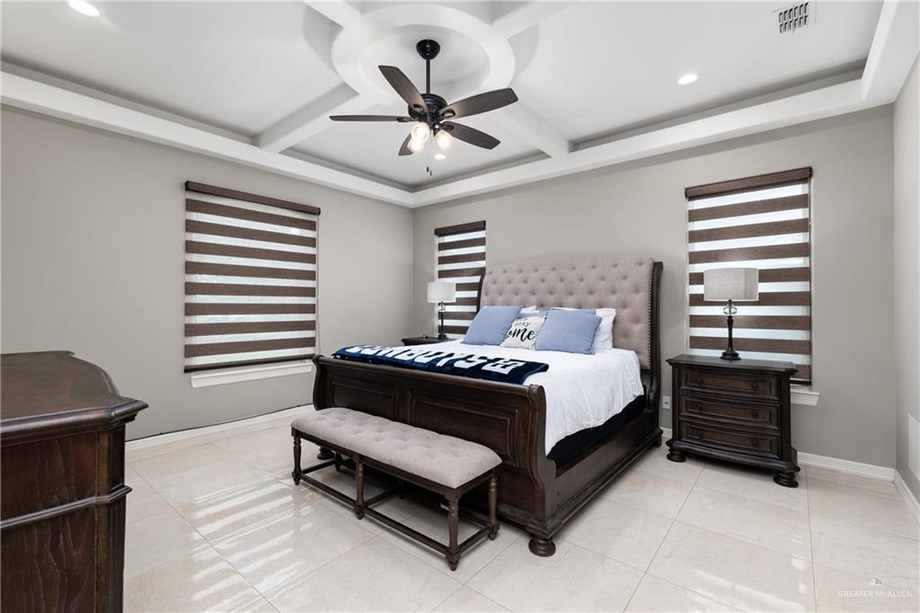 8405 Summer View Court Harlingen, TX 78552 - Photo 15 of 45 a bed room with a bed and a ceiling fan