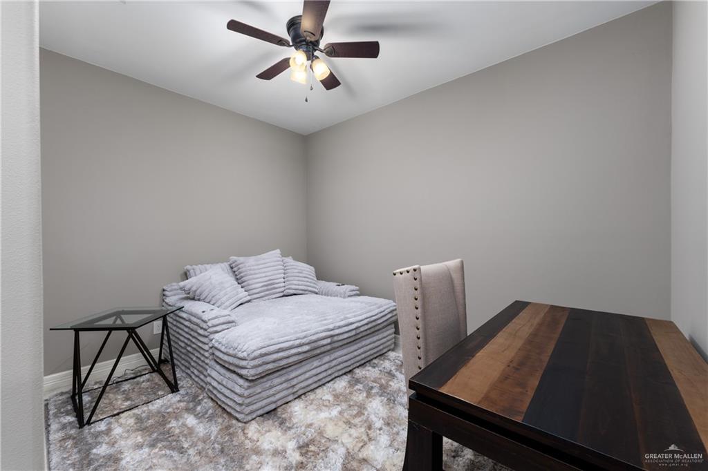 8405 Summer View Court Harlingen, TX 78552 - Photo 25 of 45 a bedroom with a bed and a chandelier