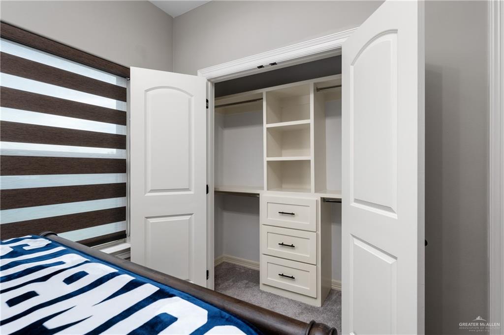 8405 Summer View Court Harlingen, TX 78552 - Photo 27 of 45 a view of walk in closet with empty racks