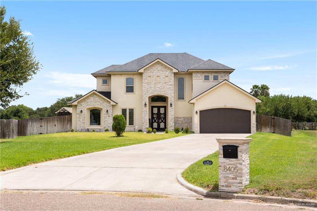 8405 Summer View Court Harlingen, TX 78552 - Photo 3 of 45 a front view of a house with garden