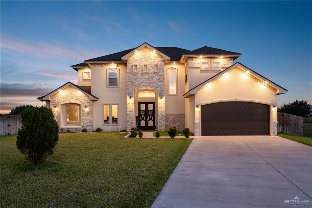 8405 Summer View Court Harlingen, TX 78552 - Photo 38 of 45 a front view of a house with a yard and garage