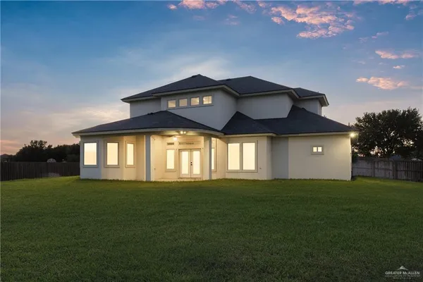 a view of a swimming pool with a yard