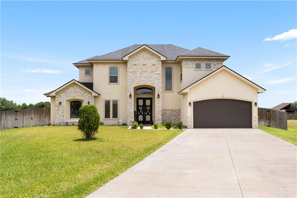 8405 Summer View Court Harlingen, TX 78552 - Photo 45 of 45 a front view of a house with a yard and garage
