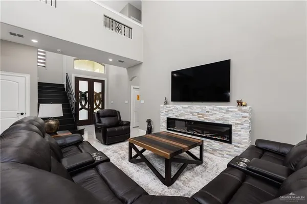 a living room with furniture and a flat screen tv