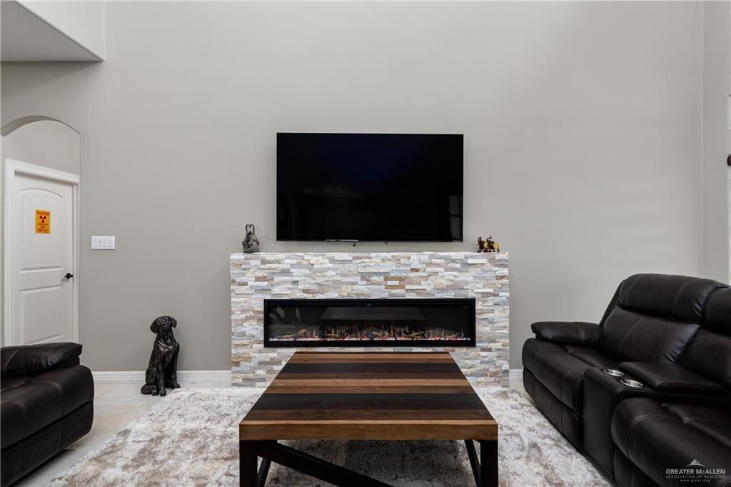 8405 Summer View Court Harlingen, TX 78552 - Photo 6 of 45 a living room with furniture and a fireplace