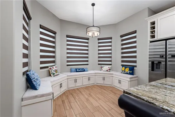 a kitchen with a stove a sink and a refrigerator