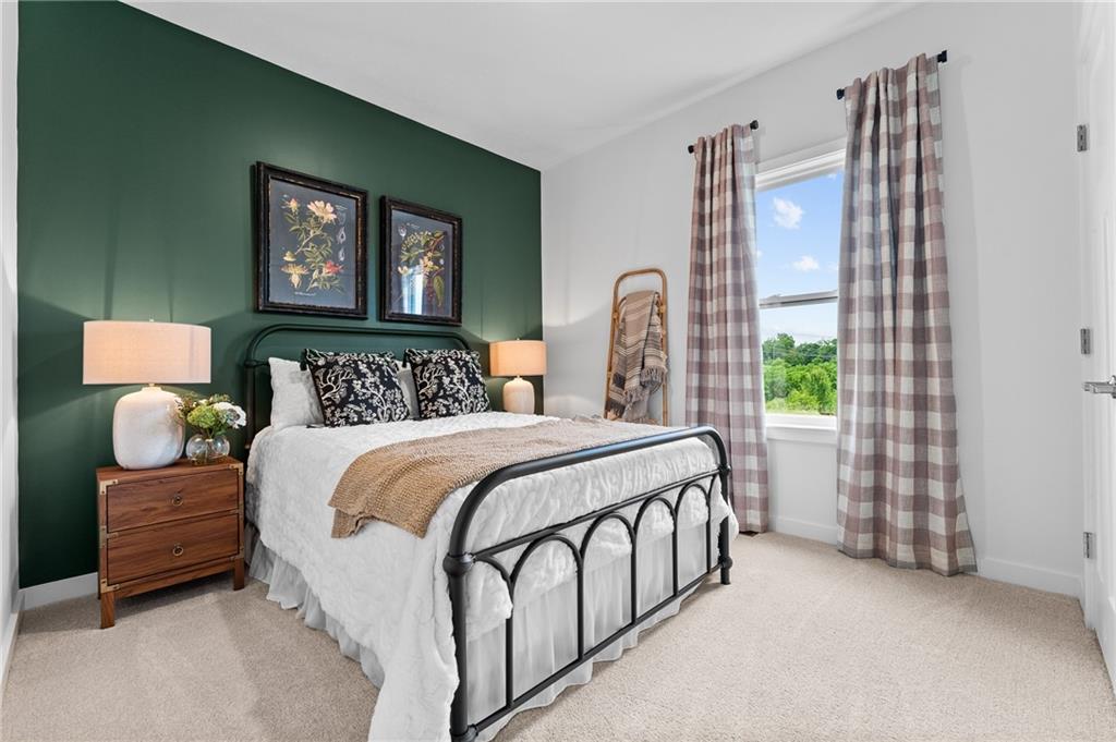 132 Deana Drive McKees Rocks, PA 15136 - Photo 4 of 9 a bedroom with a bed painting on wall and a window