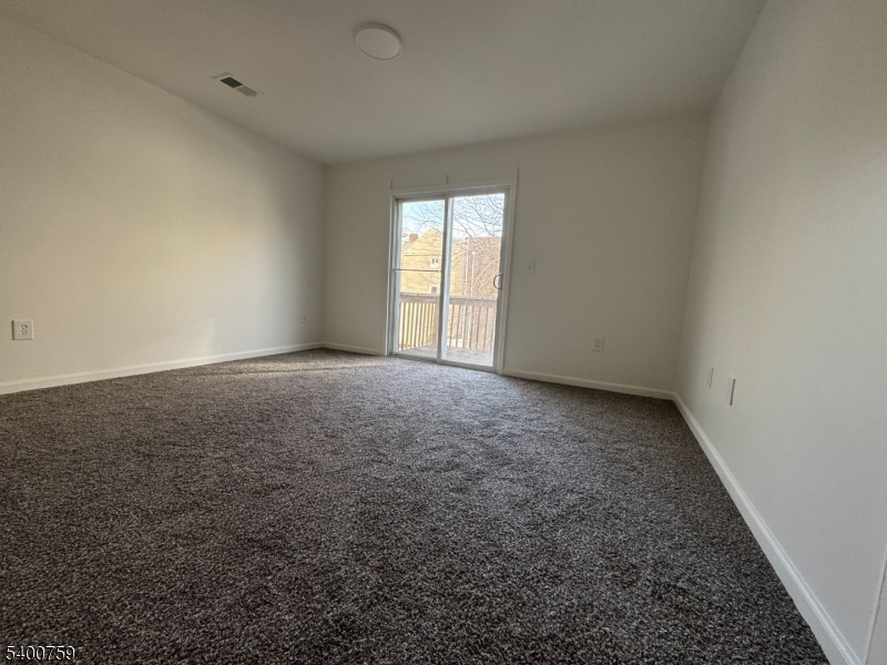 121 12th Avenue Paterson, NJ 07501 - Photo 11 of 14 an empty room with a window