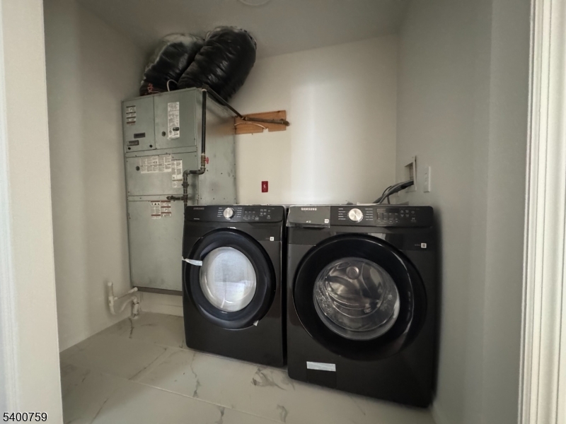 121 12th Avenue Paterson, NJ 07501 - Photo 14 of 14 a utility room with dryer and washer