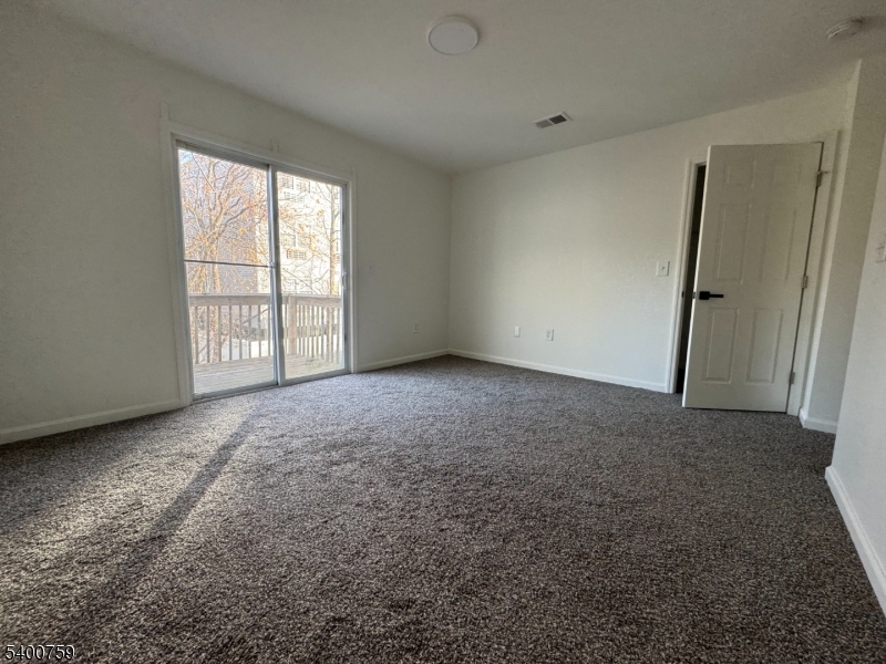 121 12th Avenue Paterson, NJ 07501 - Photo 10 of 14 an empty room with windows