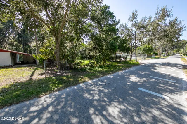 a view of a yard with of trees