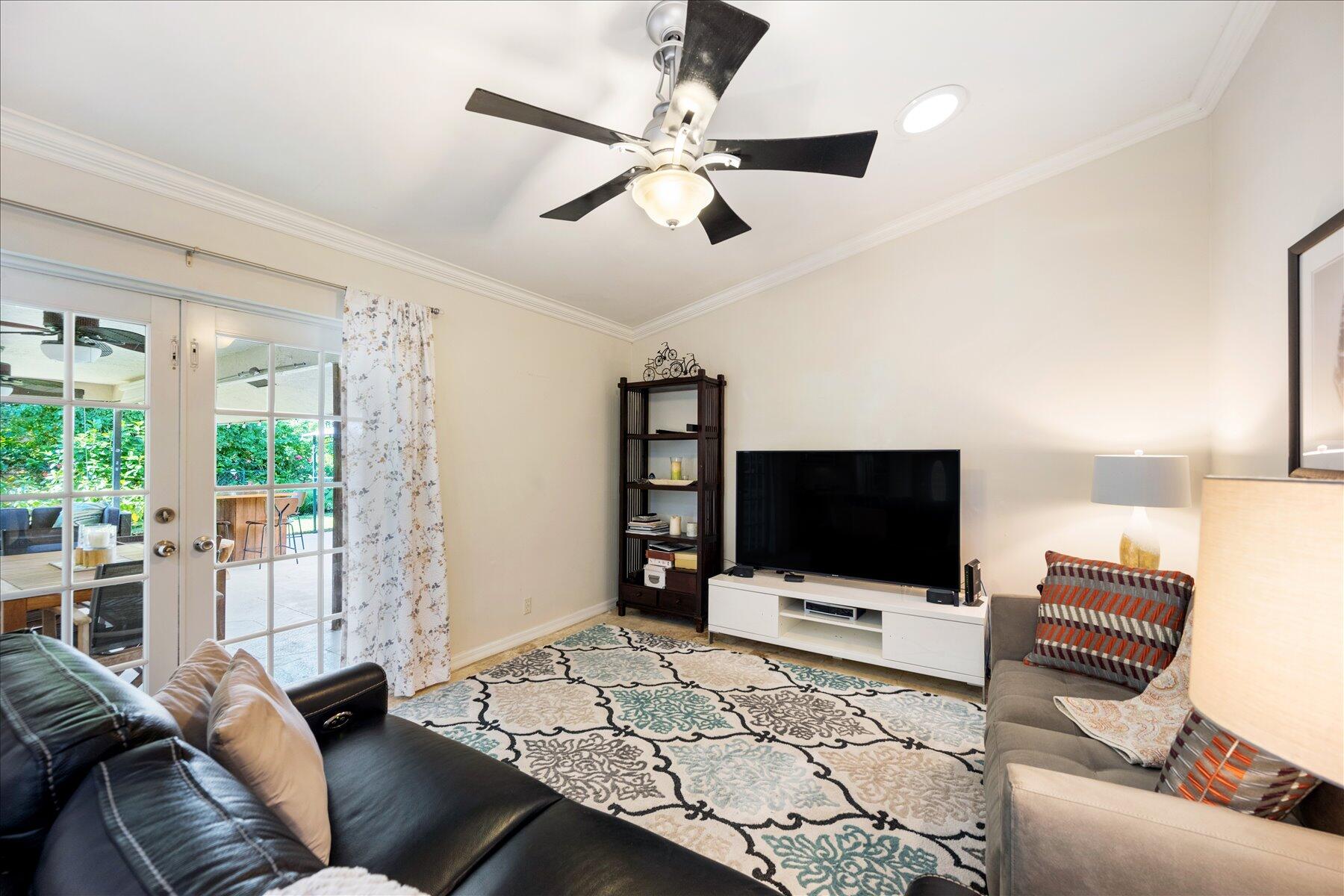 13889 Geranium Place Wellington, FL 33414 - Photo 13 of 32 a living room with furniture and a flat screen tv