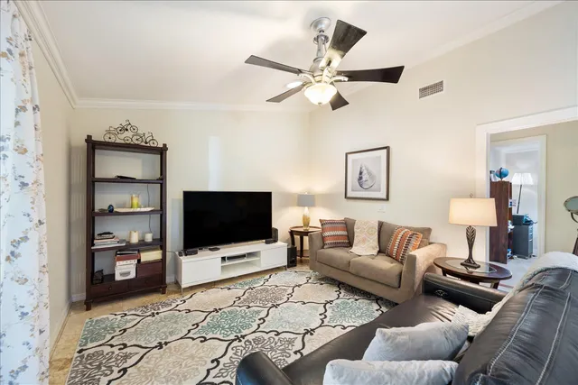 a view of a patio with a table chairs and a potted plant