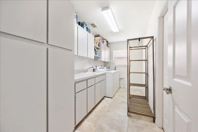 a workspace with chandelier and a window