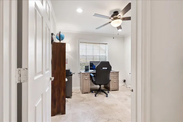 a view of workspace with wooden floor windows