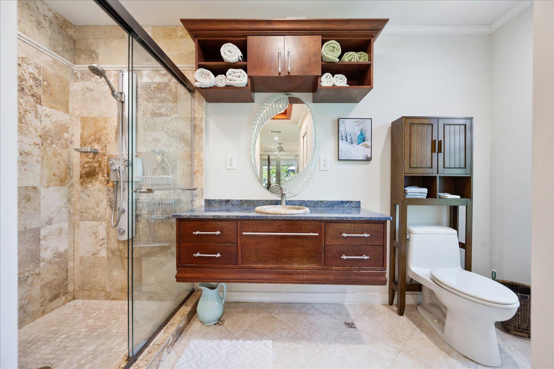 13889 Geranium Place Wellington, FL 33414 - Photo 24 of 32 a bathroom with a sink a toilet and shower